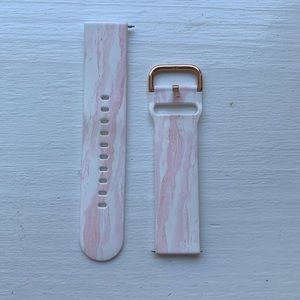 Pink and white Fitbit versa band